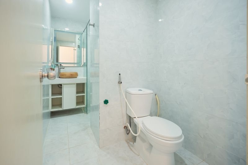 Marble bathroom with walk-in shower and toiletries