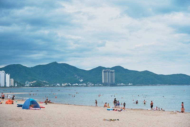 Wide view over Nha Trang bay with mountains behind the beach