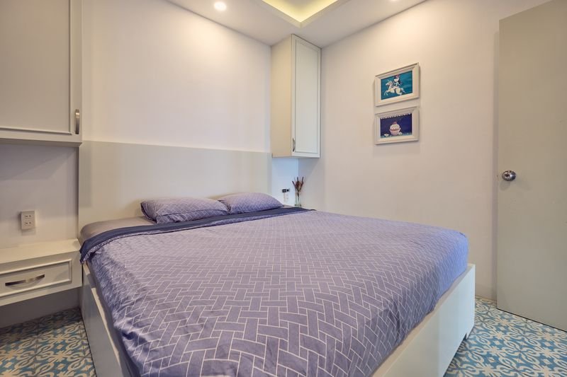 Cozy bedroom with wall art and air conditioning
