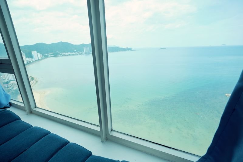 Lounge corner by the angled window above the sea