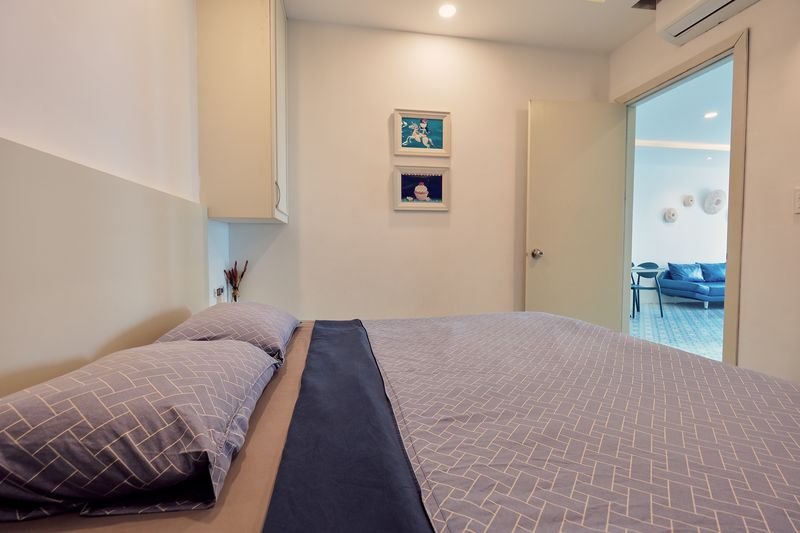 Bedroom with a view into the bright living room