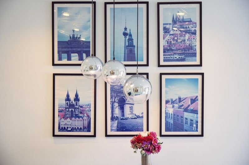 Gallery wall of blue-toned European travel prints
