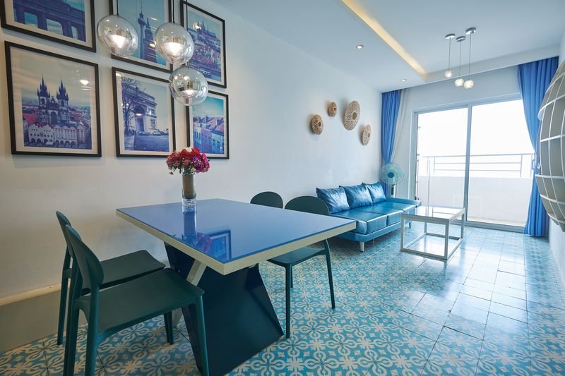 Living room with sofa, dining table and balcony door