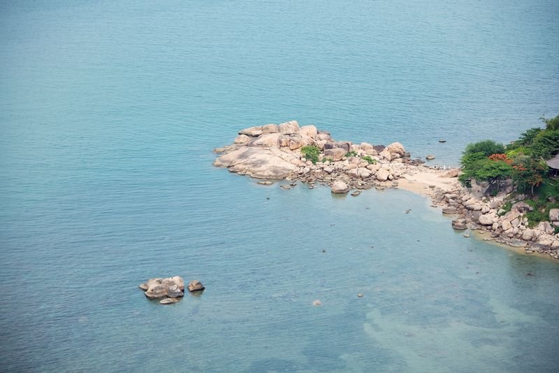 The famous Hon Chong rocks in the turquoise sea below the apartment