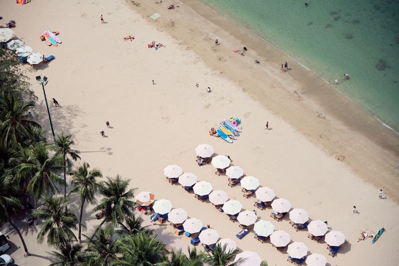 Golden sand and parasols directly below the apartment